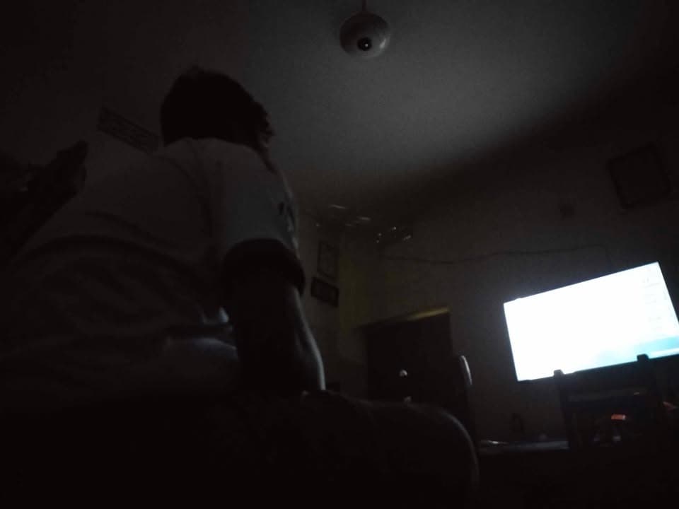 A PMBD member watching a Real Madrid match on TV at home during a late-night screening
